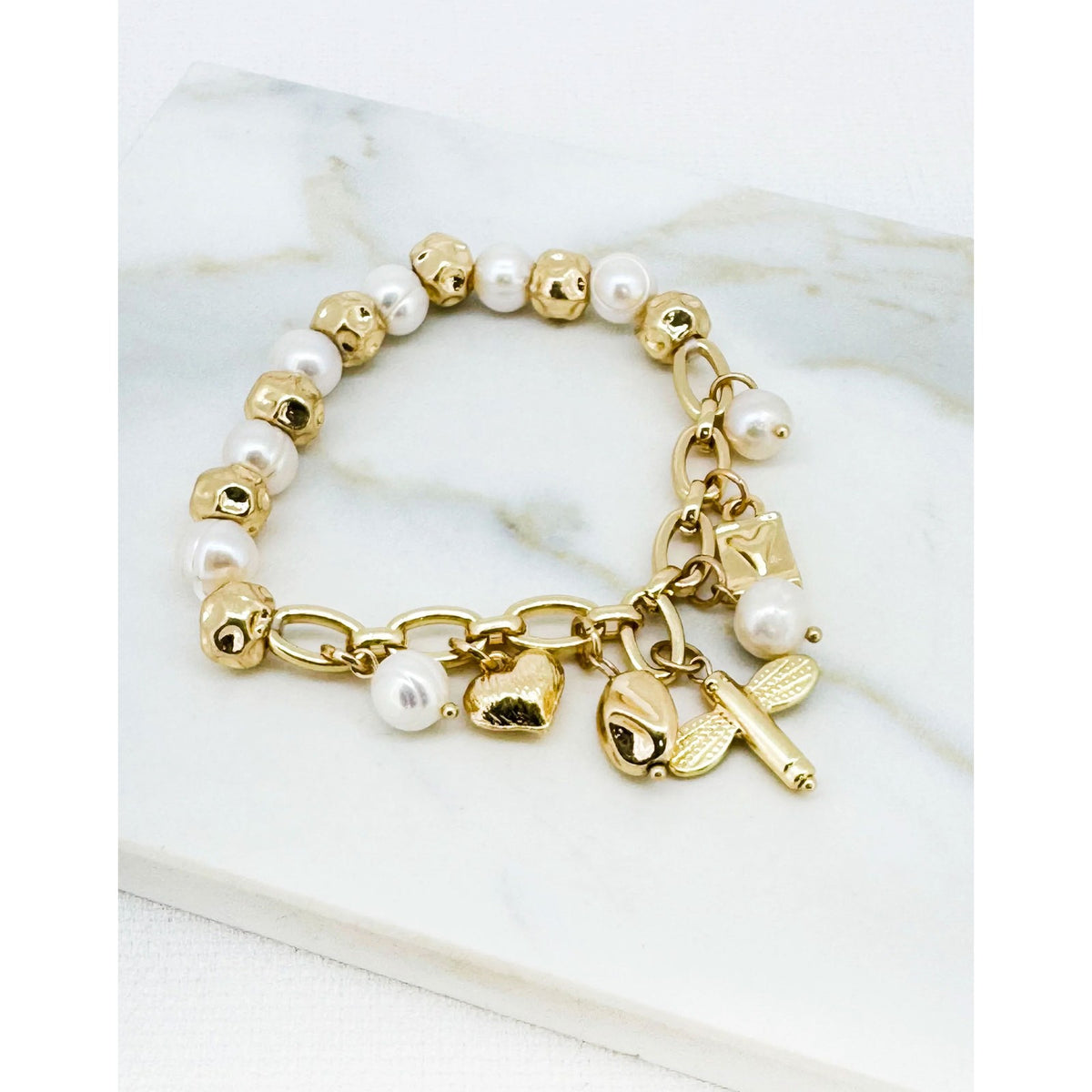 https://dknwnigc18uf4.cloudfront.net/product-media/U6Z/1600/1600/gold-pearl-and-charm-1.jpg