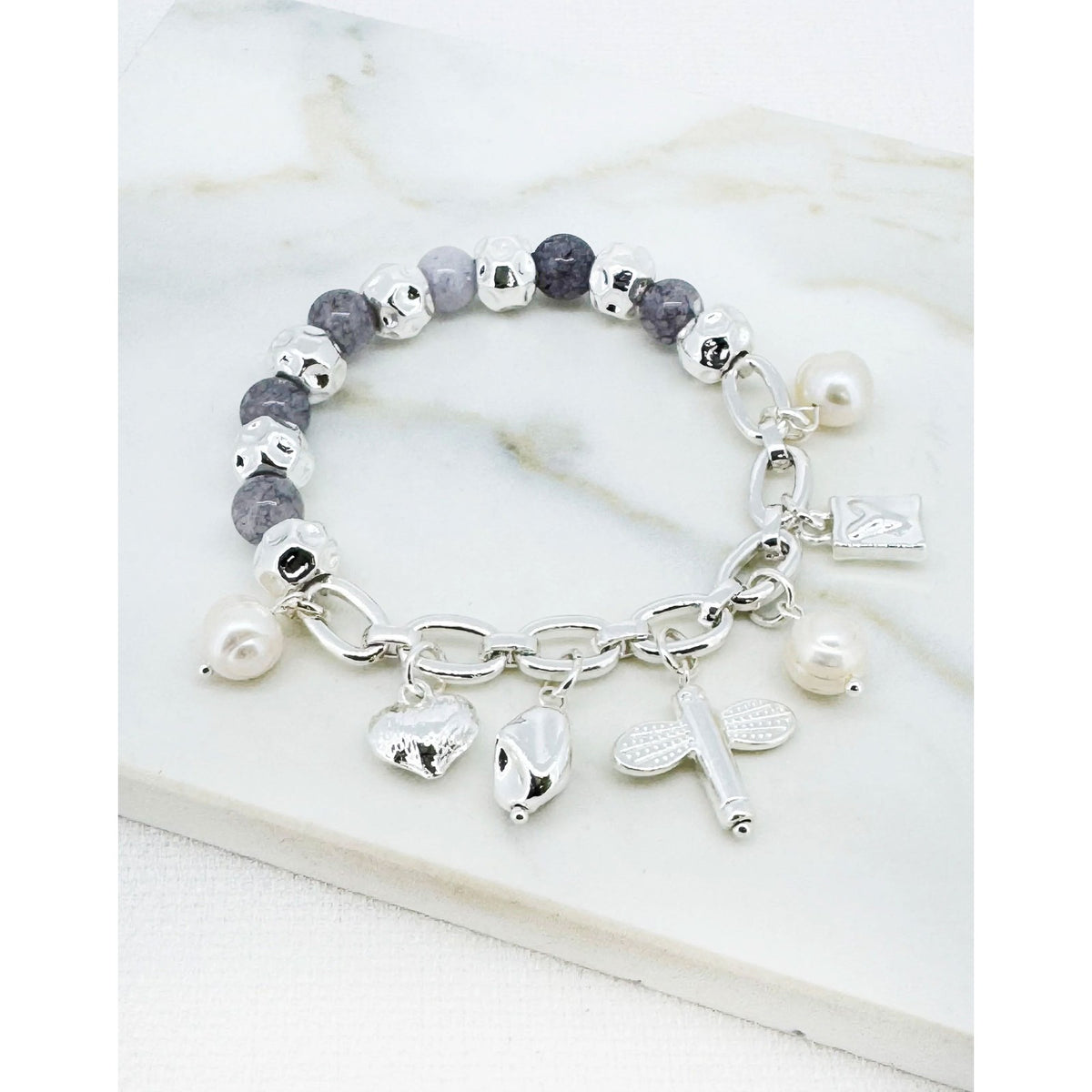 https://dknwnigc18uf4.cloudfront.net/product-media/U71/1600/1600/silver-pearl-and-charm-1.jpg