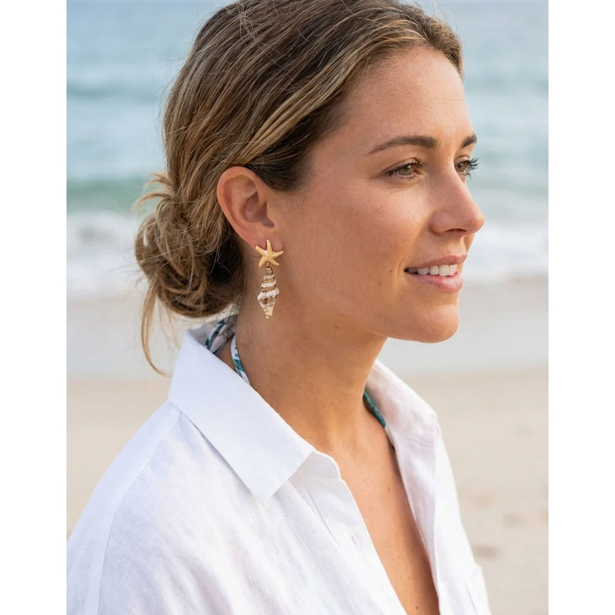 https://dknwnigc18uf4.cloudfront.net/product-media/U8A/1600/1600/star-and-shell-earrings-.jpg