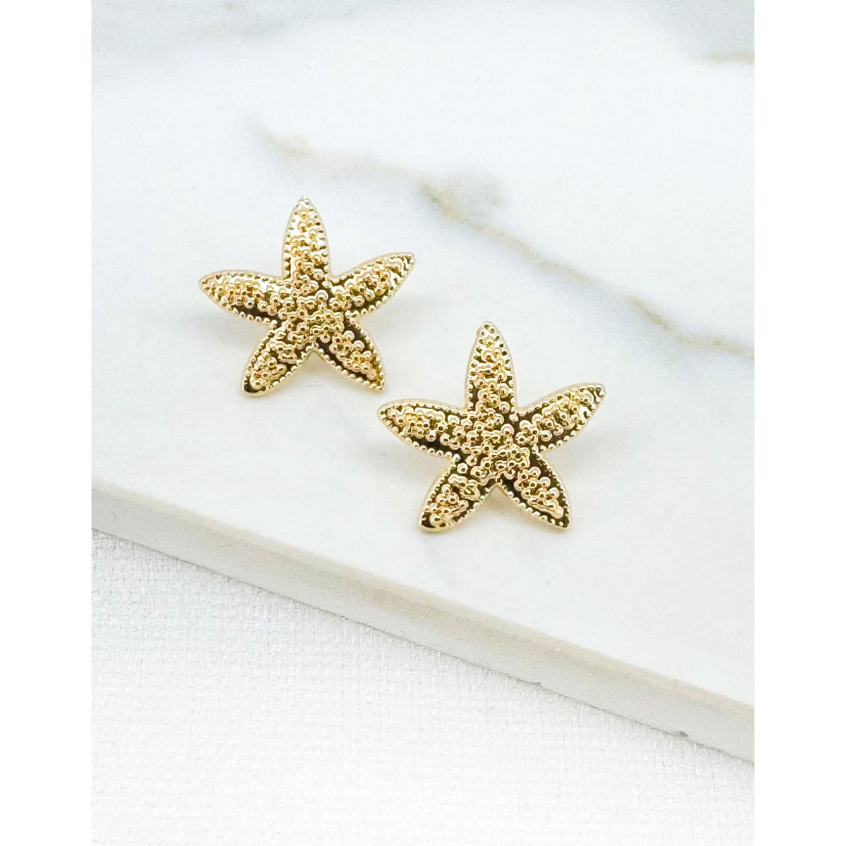 https://dknwnigc18uf4.cloudfront.net/product-media/U7B/1600/1600/starfish-earrings-1.jpg
